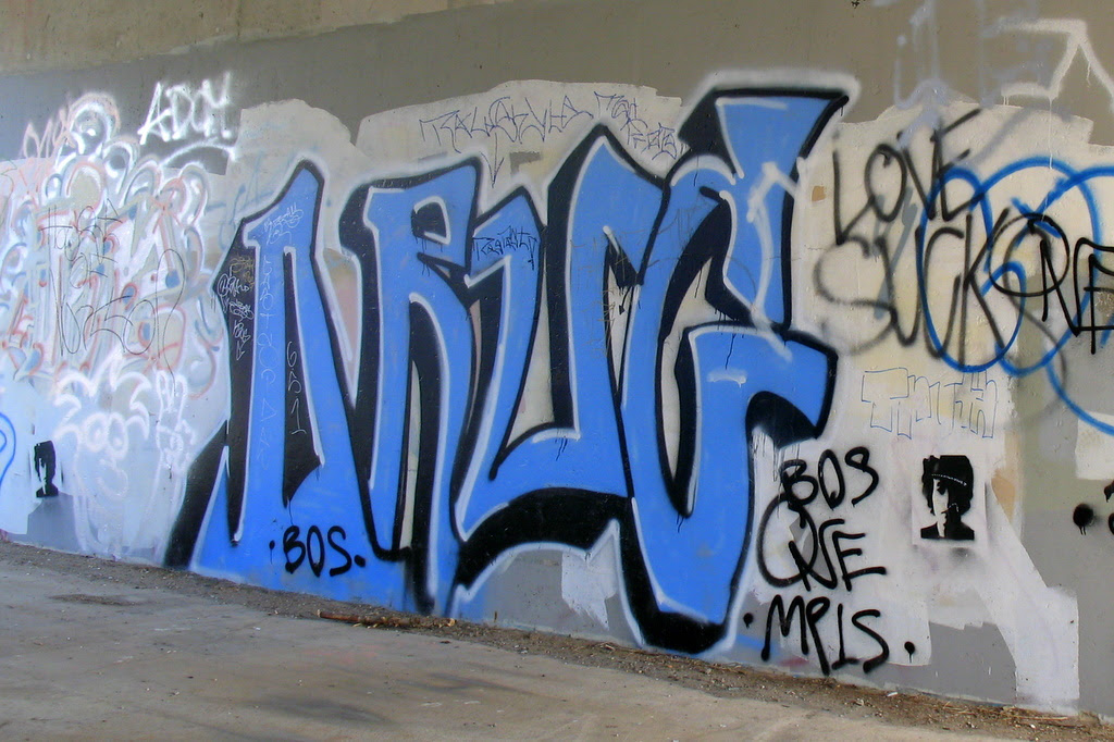 Some local graffiti artist handy work or to the rest of us, a wall that was vandalized by someone with a spray paint can