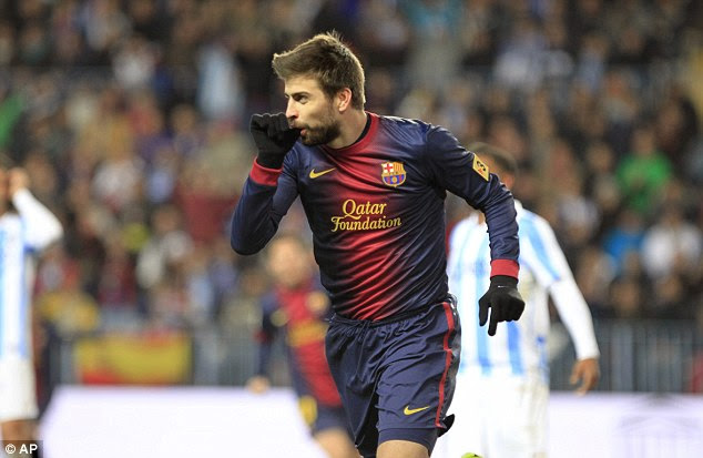 For Milan: Gerard Pique pays tribute to his newborn son after scoring Barcelona's second of the night 