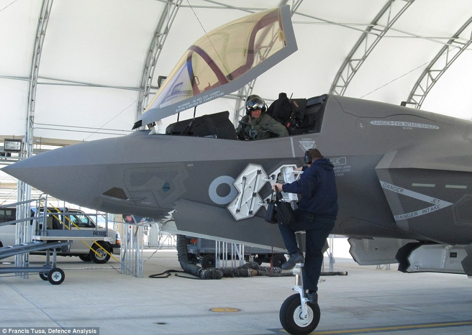 Flying into the future: A pilot sits in the cockpit of the new F-35 combat aircraft at Eglin Air Force Base in Florida. Its first British appearance is expected this summer