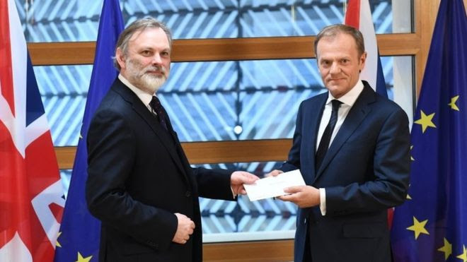 Sir Tim Barrow hands the letter to Donald Tusk