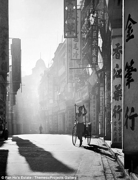 The work life a man carrying a rickshaw was captured by Mr Ho under the photo 'A Day is Done' in 1957