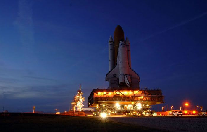Space Shuttle Discovery approaches its launch pad.