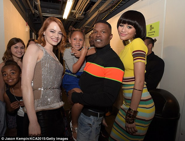 Behind the scenes: The winner, Foxx's Amazing Spider-Man 2 co-star Emma Stone (L), posed backstage with his five-year-old daughter Annalise Bishop and Zendaya