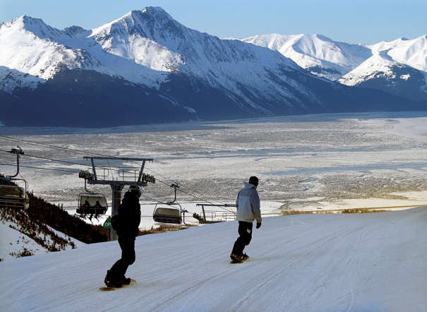 Snowboarders ski down the hill at the Alyeska Hotel and Resort in Girdwood, Alaska. 
Mark Thiessen/AP Photo