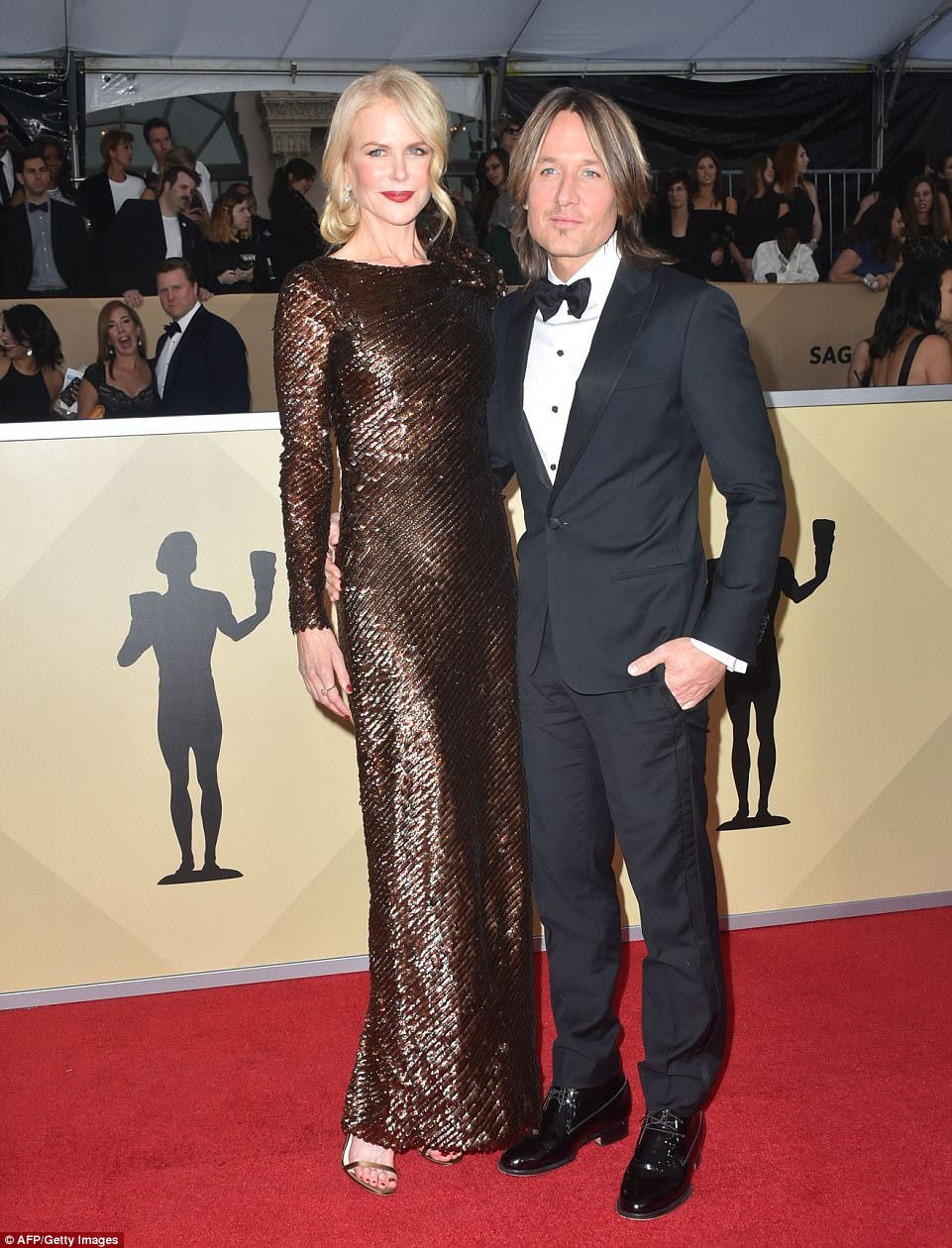 Date night! Nicole Kidman chose a sparkling copper colored gown by Armani Prive; she arrived with her husband, singer Keith Urban, who wore a Armani suit