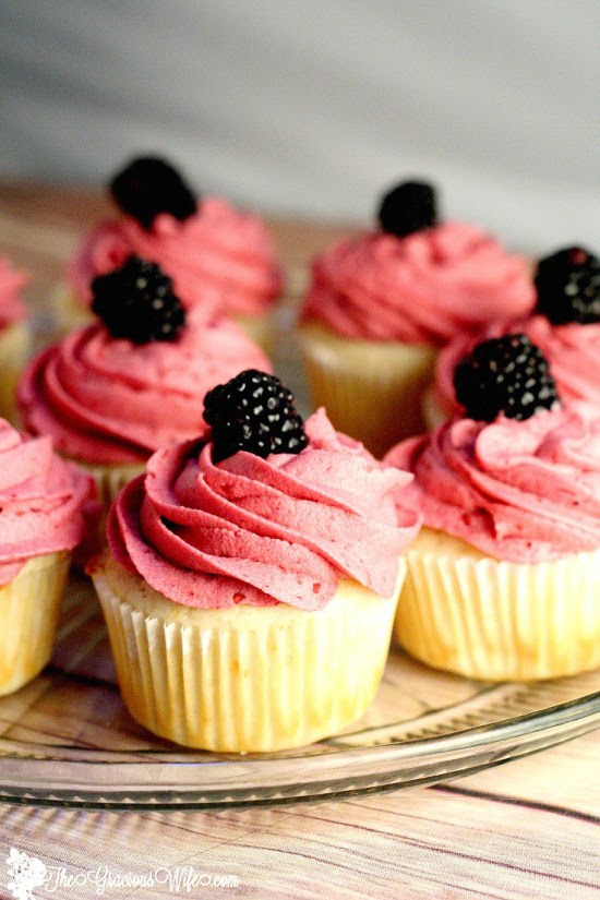 Lemon Cupcakes topped with a blackberry buttercream. From TheGraciousWife.com #lemon #cupcakes #recipe #buttercream