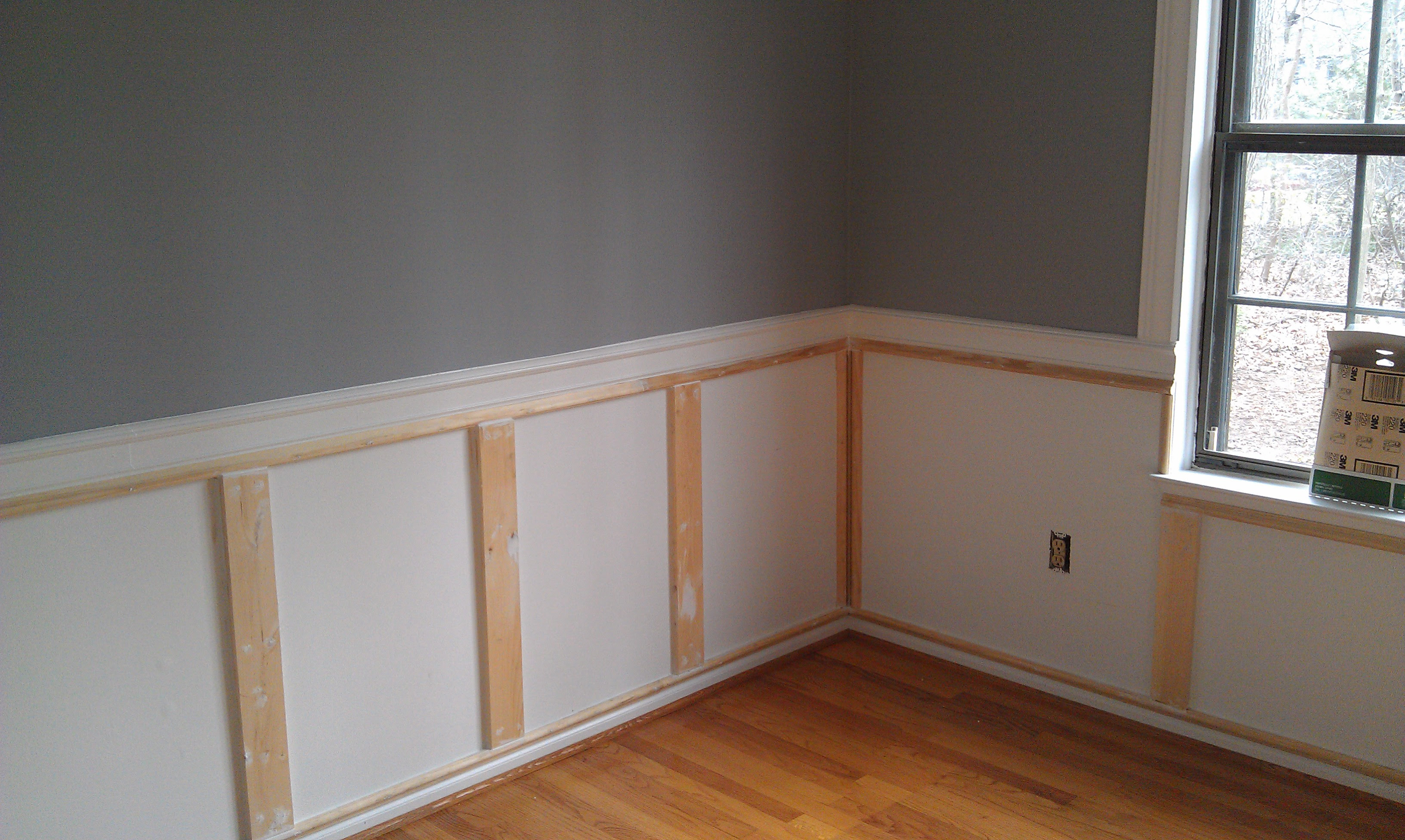 dining room with colored wainscot