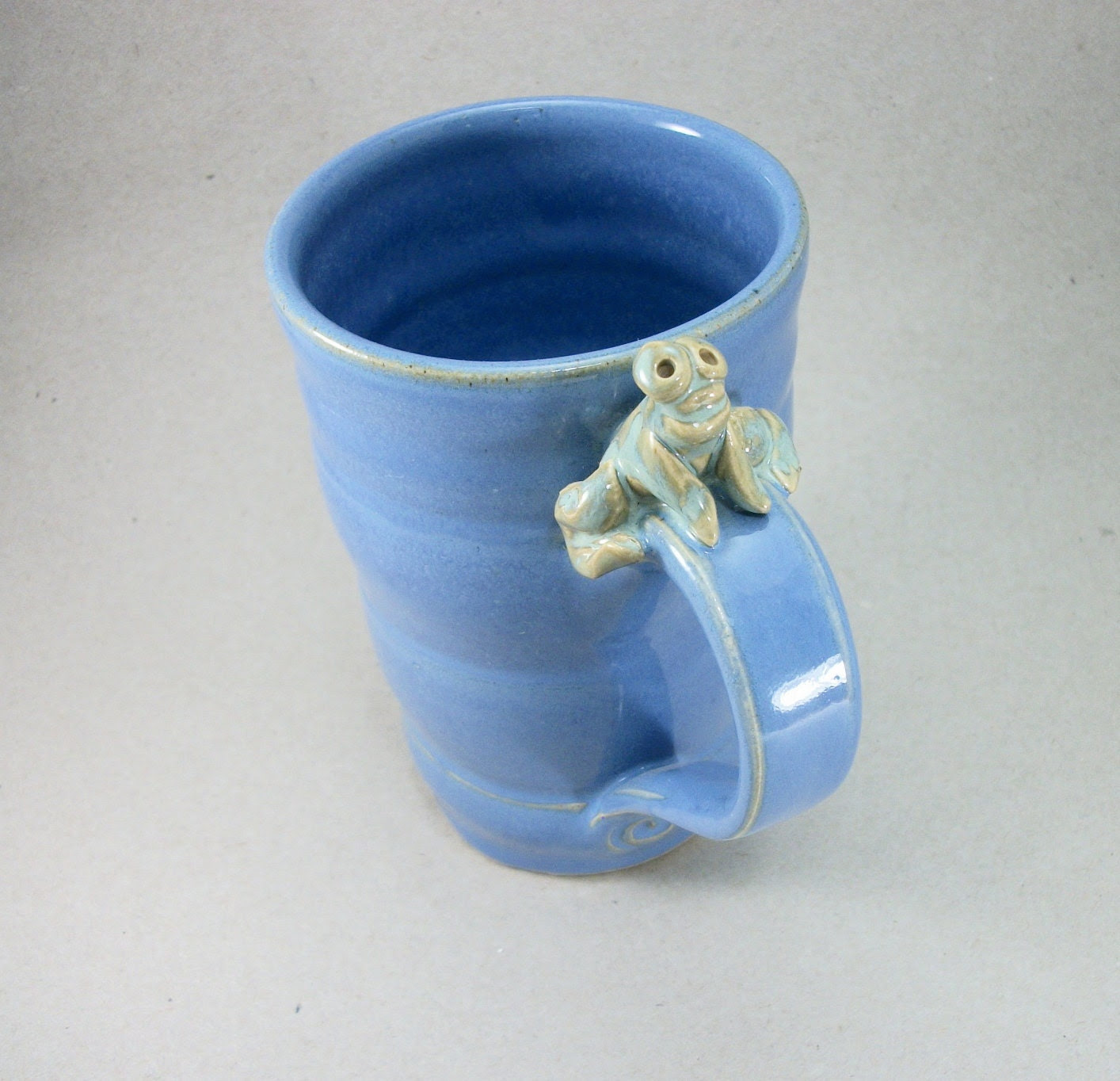 large blue mug with a frog