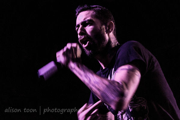 Adrian Estrella, vocals, Assuming We Survive
