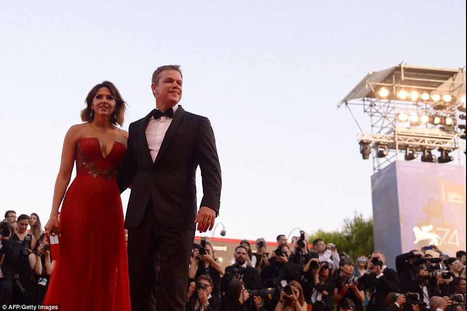 Happy to be there: The genetically gifted pair - who have been married for 12 years - looked absolutely incredible as they smiled and posed for photographers