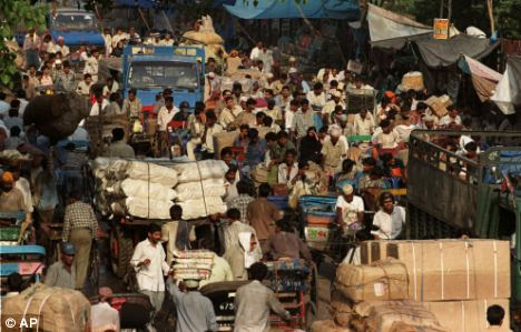Overcrowding: Indians commute on a road to the capital, Delhi, as figures revealed it could be the world's most populous country in under 20 years