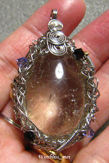 Wire wrapped pendant Wire wrapped entangled rutilated quartz pendant