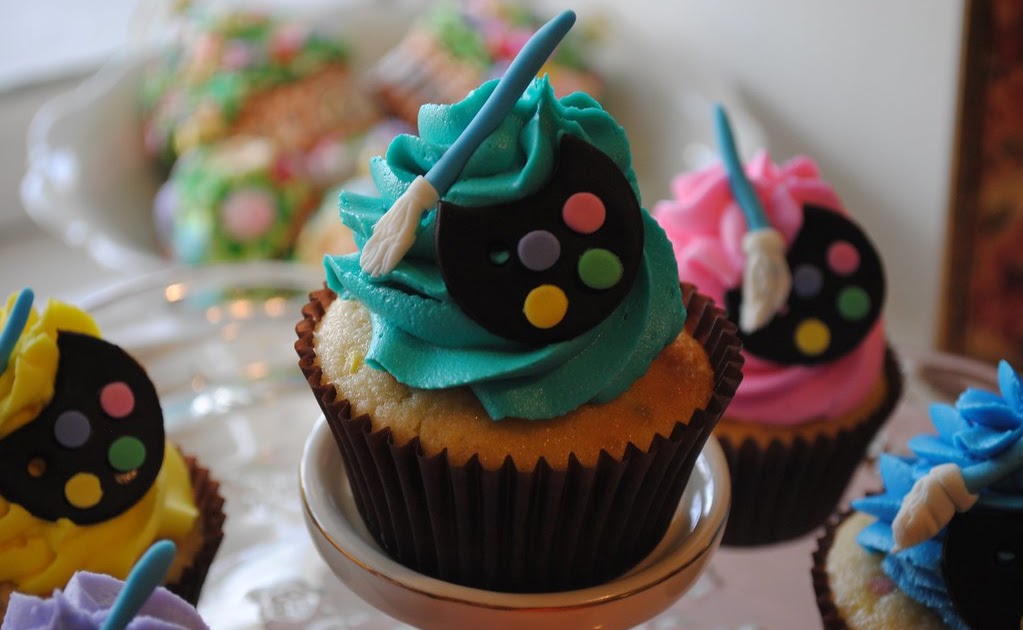 Artist easel and blackberry vanilla bean cupcakes