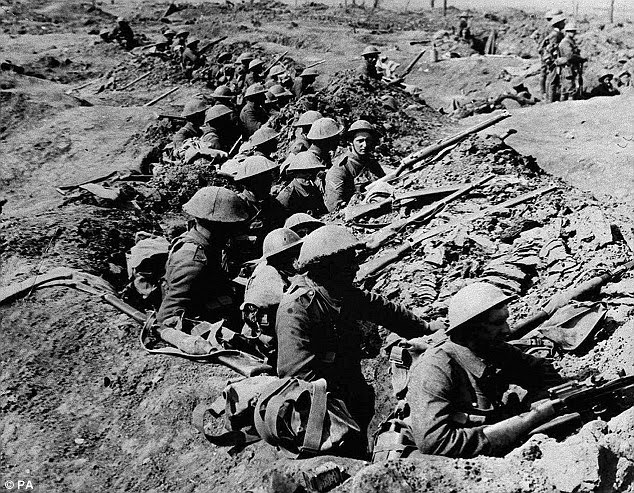 British infantrymen occupying a shallow trench before advancing during the Battle of the Somme on the first day of battle in 1916
