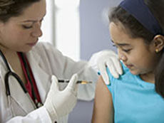 Female doctor injects a young women with HPV vaccine
