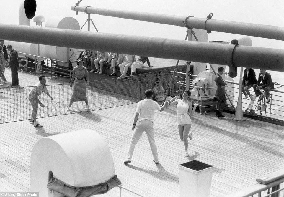 Sporting entertainment: Passengers playing a net game on the decks of transatlantic ocean liner SS Europe in 1938
