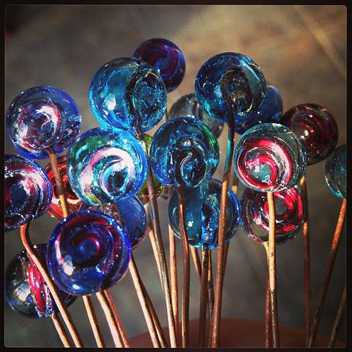 New glass "headpins". Transparent encasing swirl of copper wire. #lampwork
