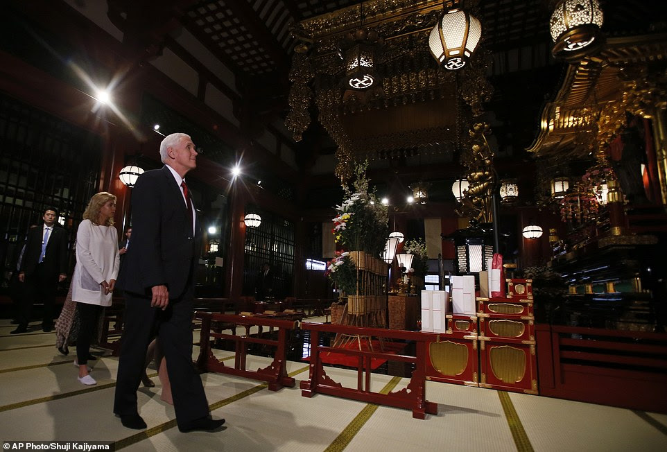 Pressure: Shinzo emphasized diplomacy, but said that 'dialogue for the sake of dialogue is valueless' and that pressure would have to be put on North Korea to come to the table. Pictured: Pence visiting a Buddhist Temple in Tokyo on Tuesday