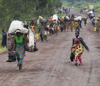 Civilians fleeing from the eastern Democratic Republic of Congo city of Goma. The United Nations Security Council has condemned actions by the M23 rebels who have reportedly siezed the important area. by Pan-African News Wire File Photos
