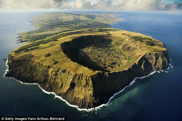 Easter Island (pictured) could be swallowed by rising ocean levels as the island's unique cultural heritage comes under threat again. Centuries ago Easter Island's civilisation collapsed for unknown reasons, leaving these mysterious statues dotted around the island