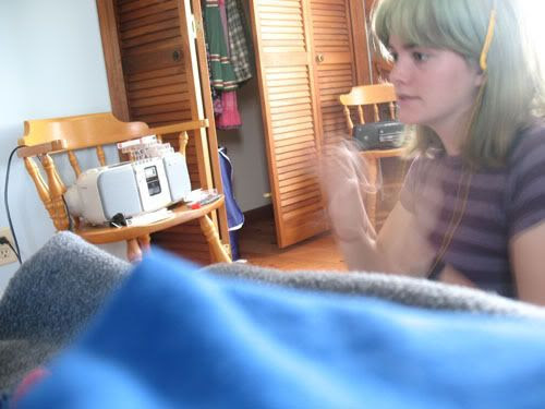 flapping with headphones on and a serious expression