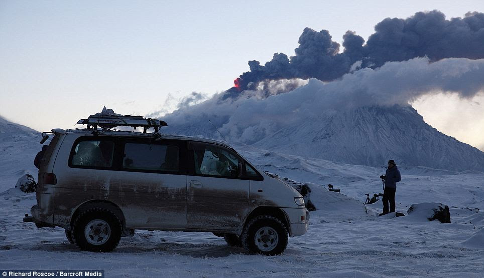 Dr Richard Roscoe is shown in front of the Kliuchevskoi volcano to west of the Kamchatka region in Russia.
