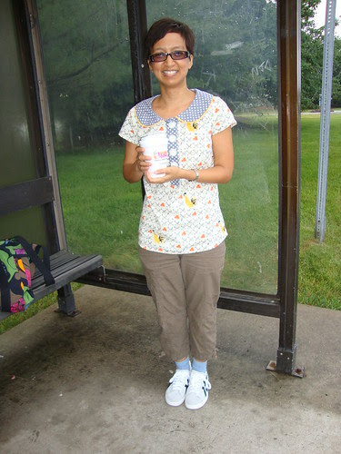 ATP with Dunkin Donuts coffee waiting for bus to NYC