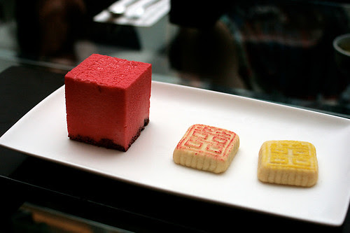 East meets West desserts - raspberry chocolate mousse and two pastries with red bean and lotus paste within