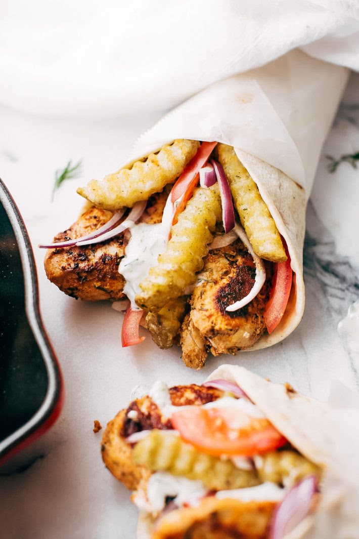 Easy Chicken Gyros with French Fries and Tzatziki Sauce - Learn how to make the easiest chicken gyros! Perfect for weeknight dinners! #chickengyros #gyros #gyrosrecipe #greekchicken | Littlespicejar.com