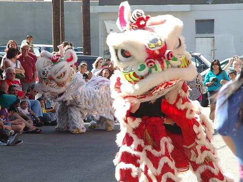 red and white lion dancers