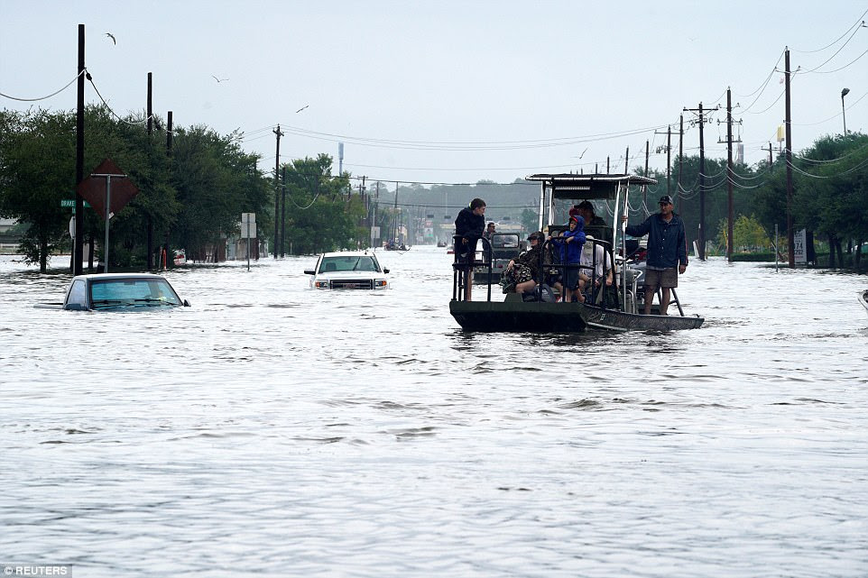 The main street is covered by flood waters from Hurricane Harvey in Dickinson, Texas on Sunday 