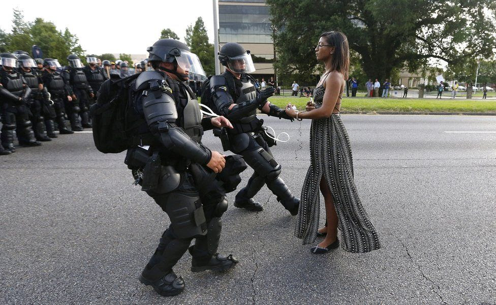 A demonstrator protesting at the shooting death of Alton Sterling is detained by law enforcement near the headquarters of the Baton Rouge Police Department in Baton Rouge, Louisiana, US July 9, 2016.