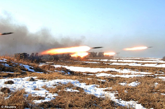 A dramatic picture shows rockets being launched during the landing and ant-landing exercise