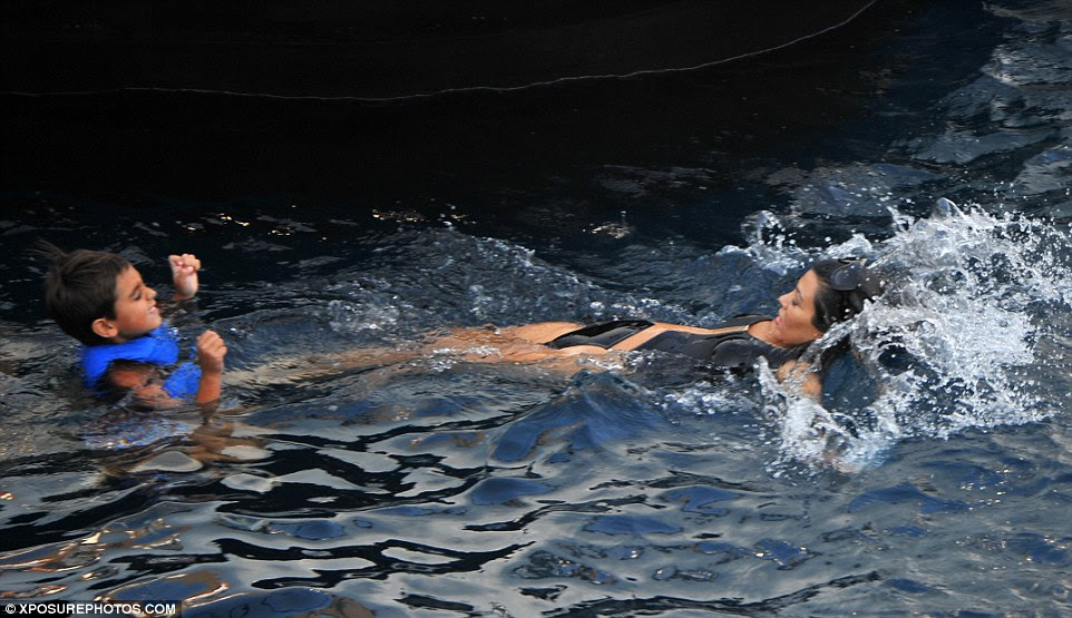 Chilling: The KUWTK star showed off her floating skills