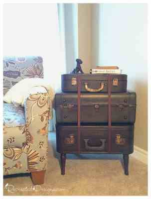 stack of vintage suitcases made into side table