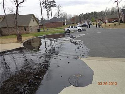 Spilt oil from Exxon pipeline run through North Woods Subdivision in Mayflower, Arkansas in this March 29, 2013 photo released to Reuters on April 11, 2013. REUTERS-EPA-Handout