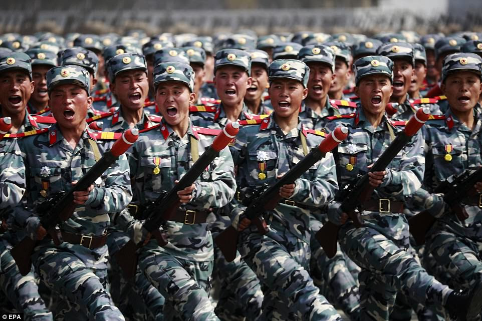 Meanwhile US Vice President Mike Pence has warned the 'era of patience' with Kim Jong-un is over and insisted America's commitment to South Korea is 'iron-clad'. Pictured: North Korean troops 