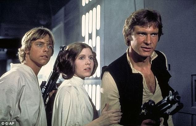 Laser blasters were also used throughout the films, seen here in 'Star Wars: Episode IV, A New Hope' (1977) with actors, from left, Mark Hamill as Luke Skywalker, Carrie Fisher as Princess Leia and Harrison Ford as Han Solo. THe US military is increasingly looking into laser weapons
