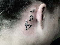 Female Music Note Tattoo Behind Ear