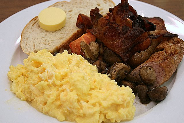 Jones English Breakfast - slice of sourdough, butter, smoked bacon, two pork sausages, sauteed mushrooms, roasted tomatoes and a whole lotta scrambled egg