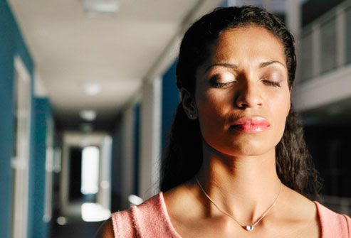 Woman breathing for headache relief