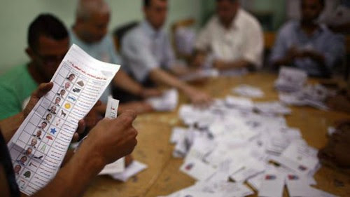 Egyptian election officials count votes in Cairo on May 24, 2012. The Freedom and Justice Party (FJP) which is allied with the Muslim Brotherhood is claiming to have taken an early lead. by Pan-African News Wire File Photos