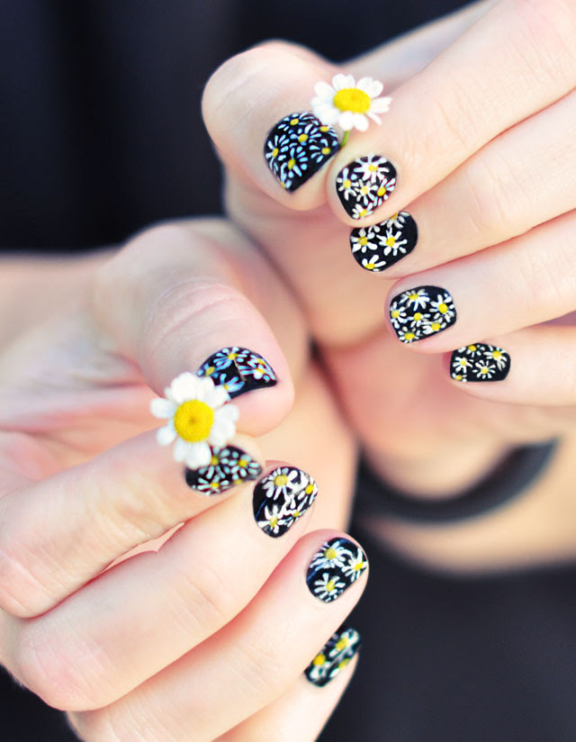 DIY Daisy Nail Art on black manicure