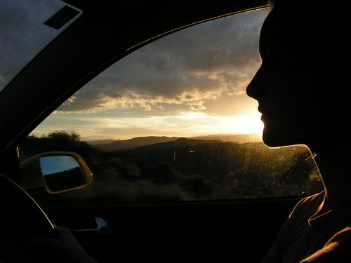 kristen driving at sunset