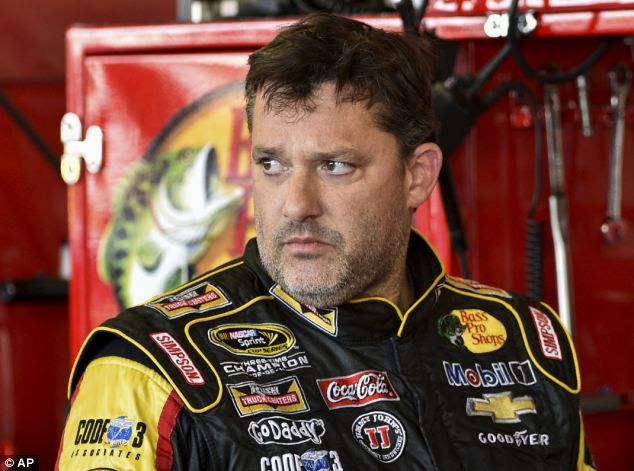 Hothead: Tony Stewart, pictured on Friday, has been questioned by investigators after he hit and killed a 20-year-old fellow race driver on a dirt track during a New York competition on Saturday