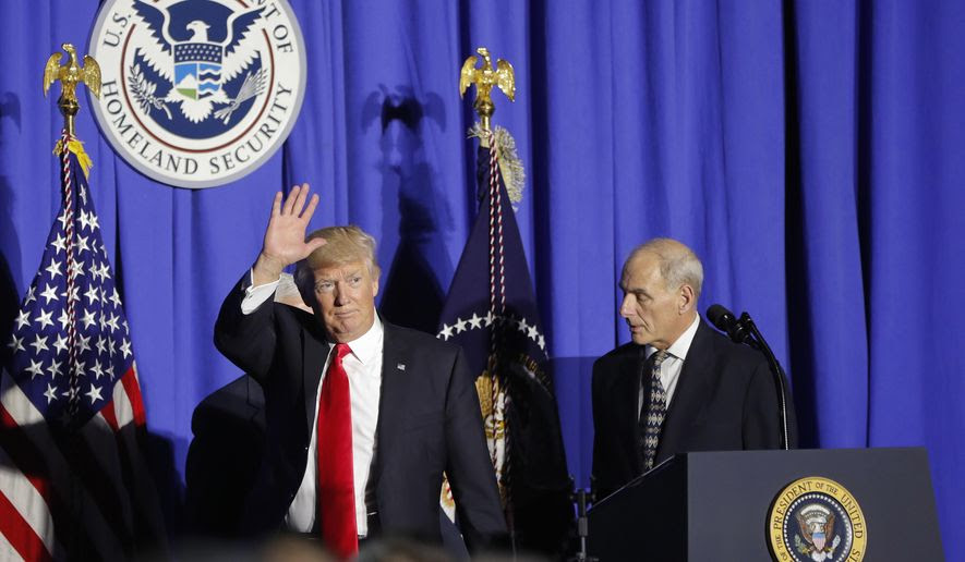 President Donald Trump, followed by Homeland Security Secretary John F. Kelly, waves as he steps off stage after speaking at the Homeland Security Department in Washington, Wednesday, Jan. 25, 2017. (AP Photo/Pablo Martinez Monsivais)