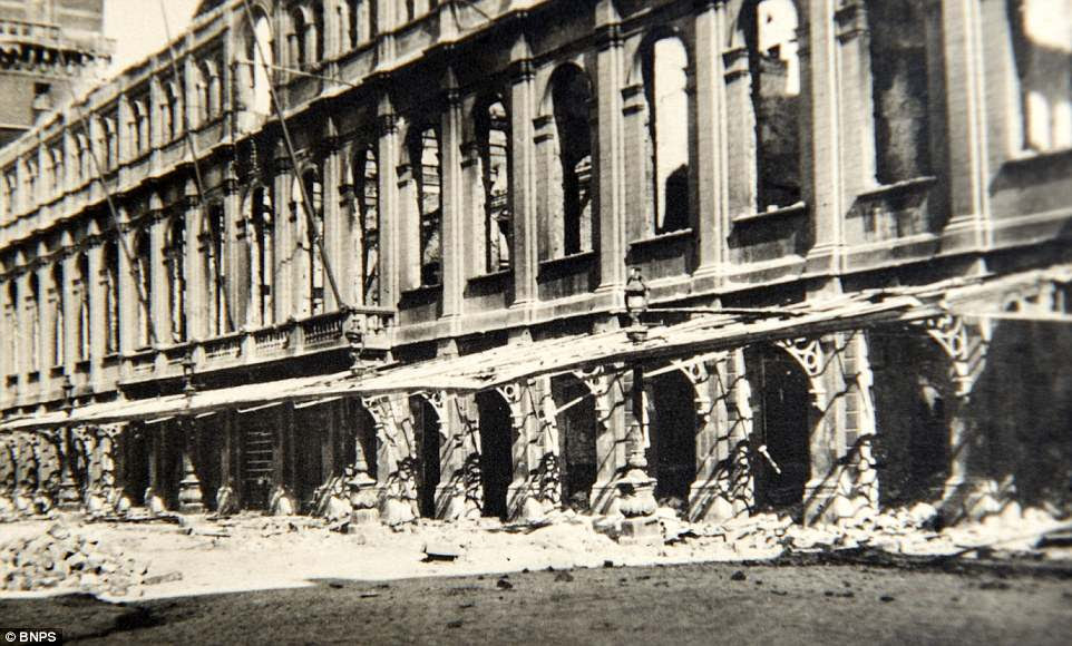 Mystery surrounds who took the photos, but it is likely that they were captured by a German soldier. Pictured, damaged shops in the Belgium town of La Panne
