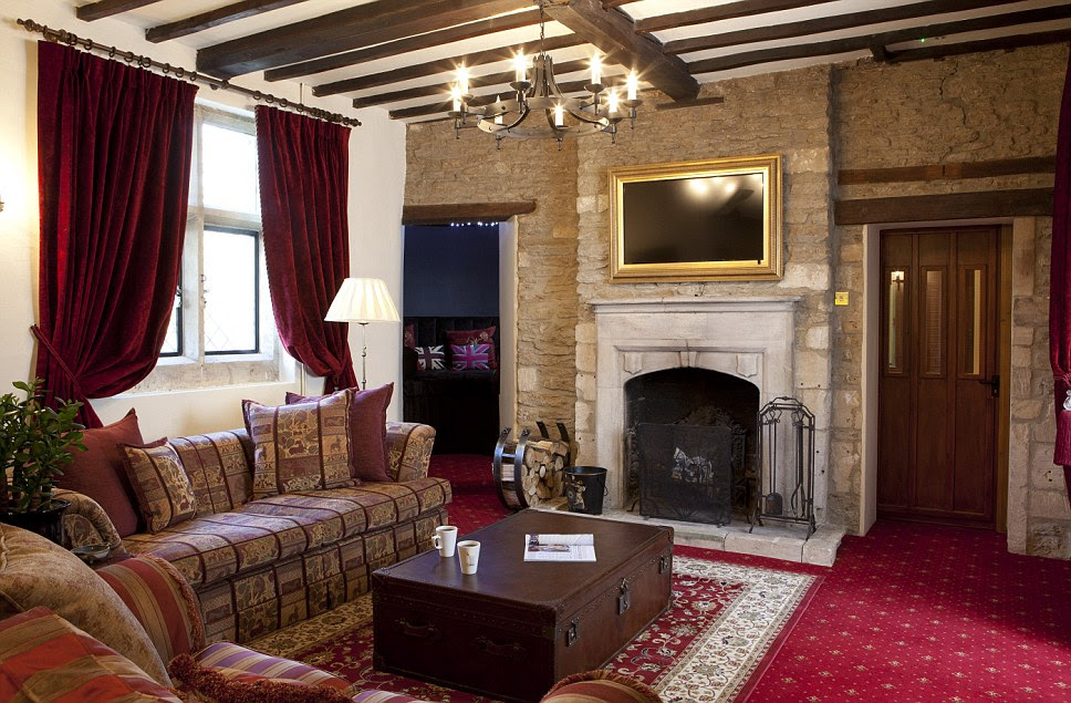 Stone walls and a striking fireplace stand out as the feature pieces in the drawing room at Bath Lodge Castle