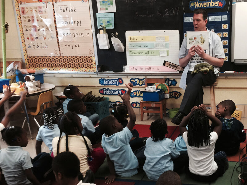 Thomas O'Donnell reads about Twiggle the Turtle to his kindergartners at Matthew Henson Elementary School in Baltimore.