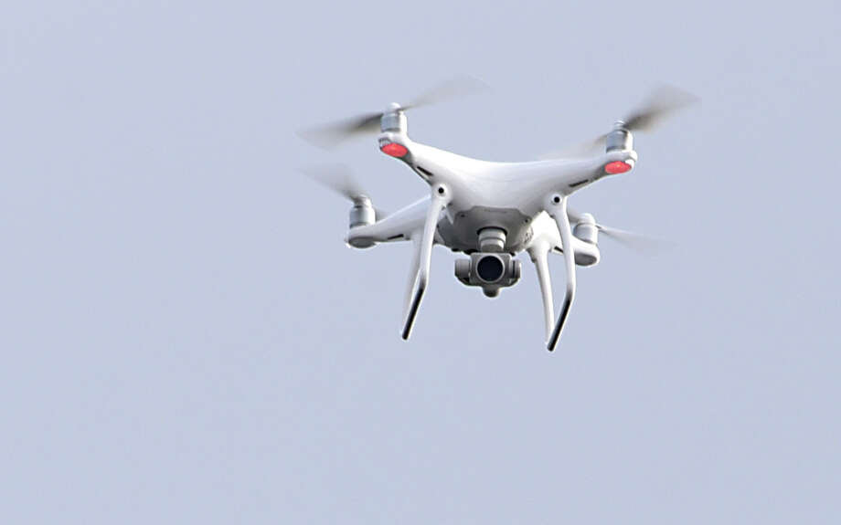 A drone is seen in this file photo at Lake George, N.Y. A drone operator was arrested Sunday's 49ers-Seahawk game, after attempting to distribute flyers to fans via drone. The same man also attempted to distribute flyers at the Oakland Coliseum, before he was arrested. Photo: Lori Van Buren / 20039281A